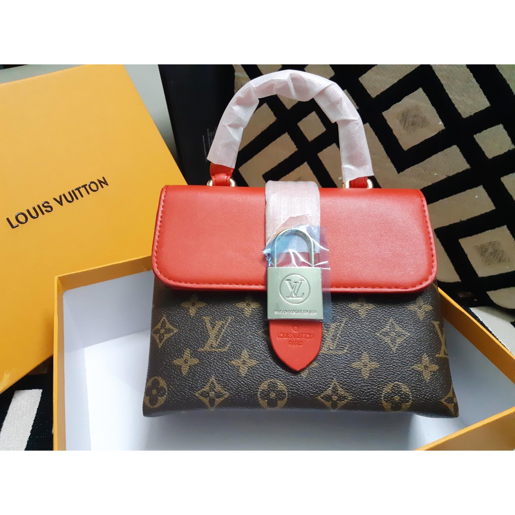 Túi xách trang trí hình ổ khóa cho chị em đi đám tiệc