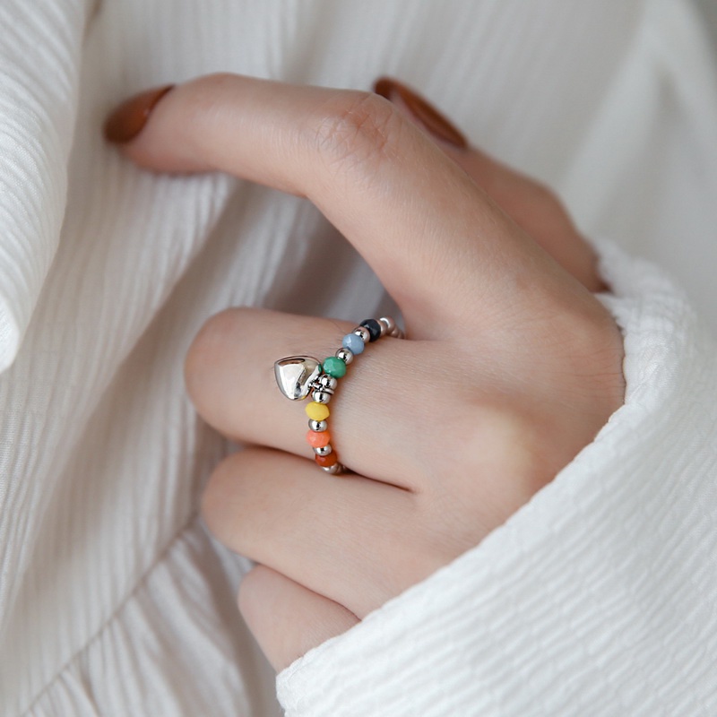 Nhẫn nữ titan kiểu xâu chuỗi bi tròn và thủy tinh màu sắc mặt cười trái tim không gỉ WE2209