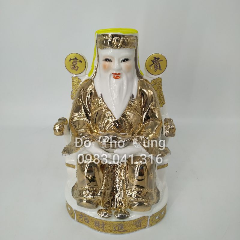 Ông tài ông địa  vắt chân ánh kim.