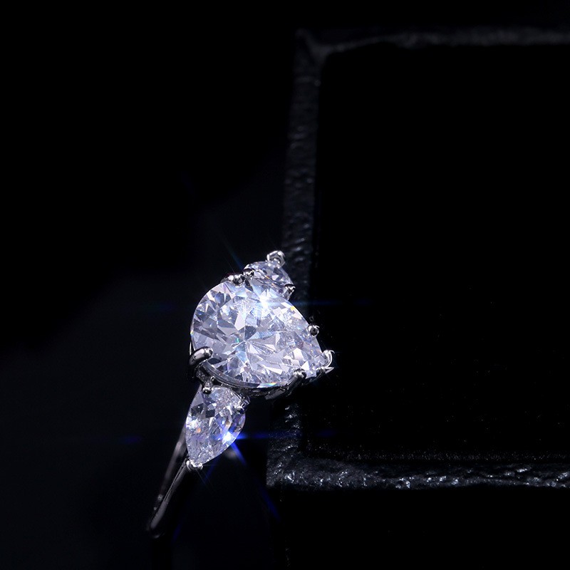 Inlaid water drop pear-shaped zircon ring female European and American creative flash diamond engagement