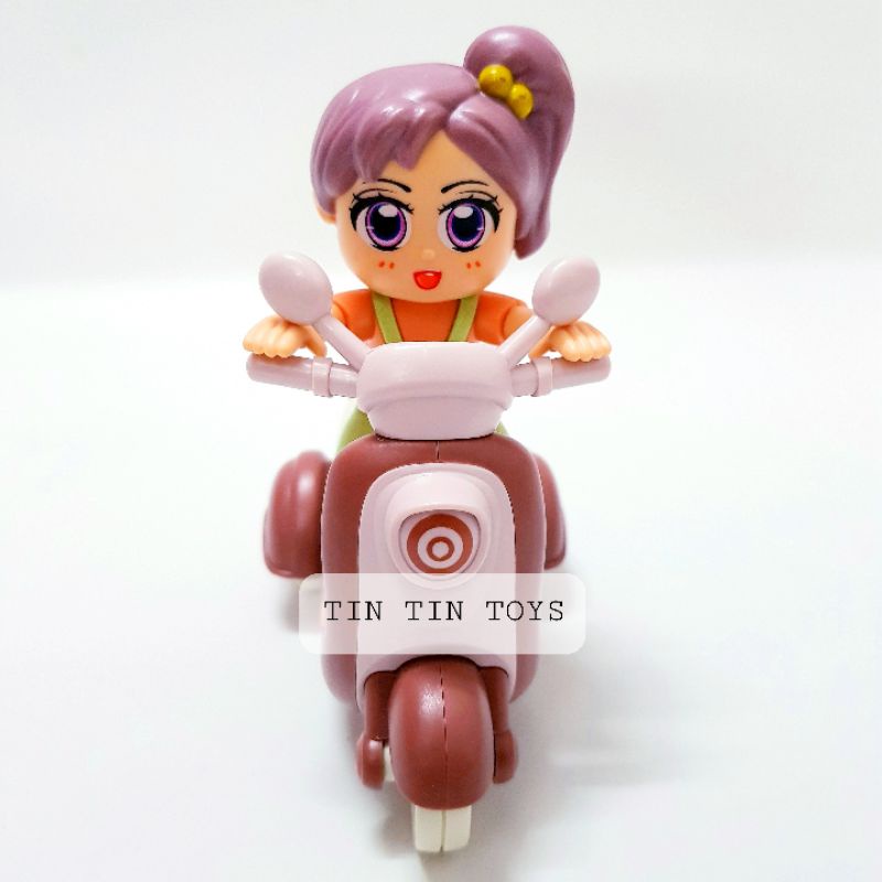 Đồ chơi cô bé chạy xe máy siêu dễ thương