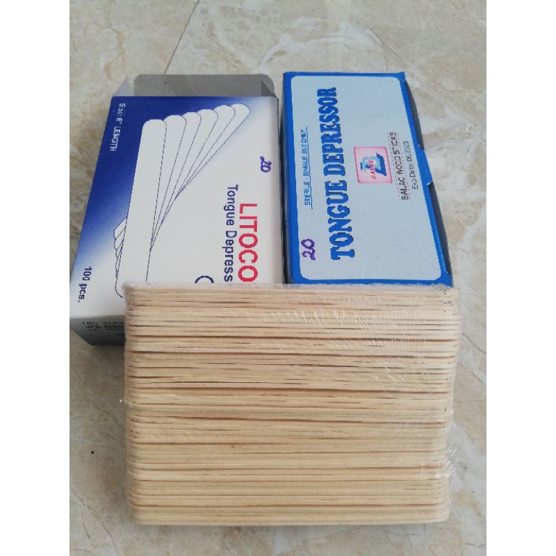 que đè lưỡi gỗ tiệt trùng