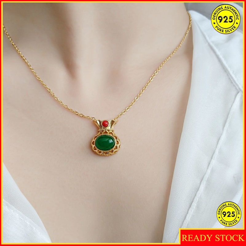 Dây chuyền may mắn hình túi xách đính ngọc lục bảo