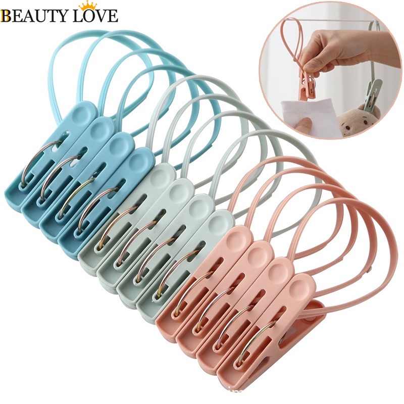 Móc Treo Quần Áo Bằng Nhựa Đa Năng Màu Sắc Ngẫu Nhiên Kèm Kẹp Tiện Dụng