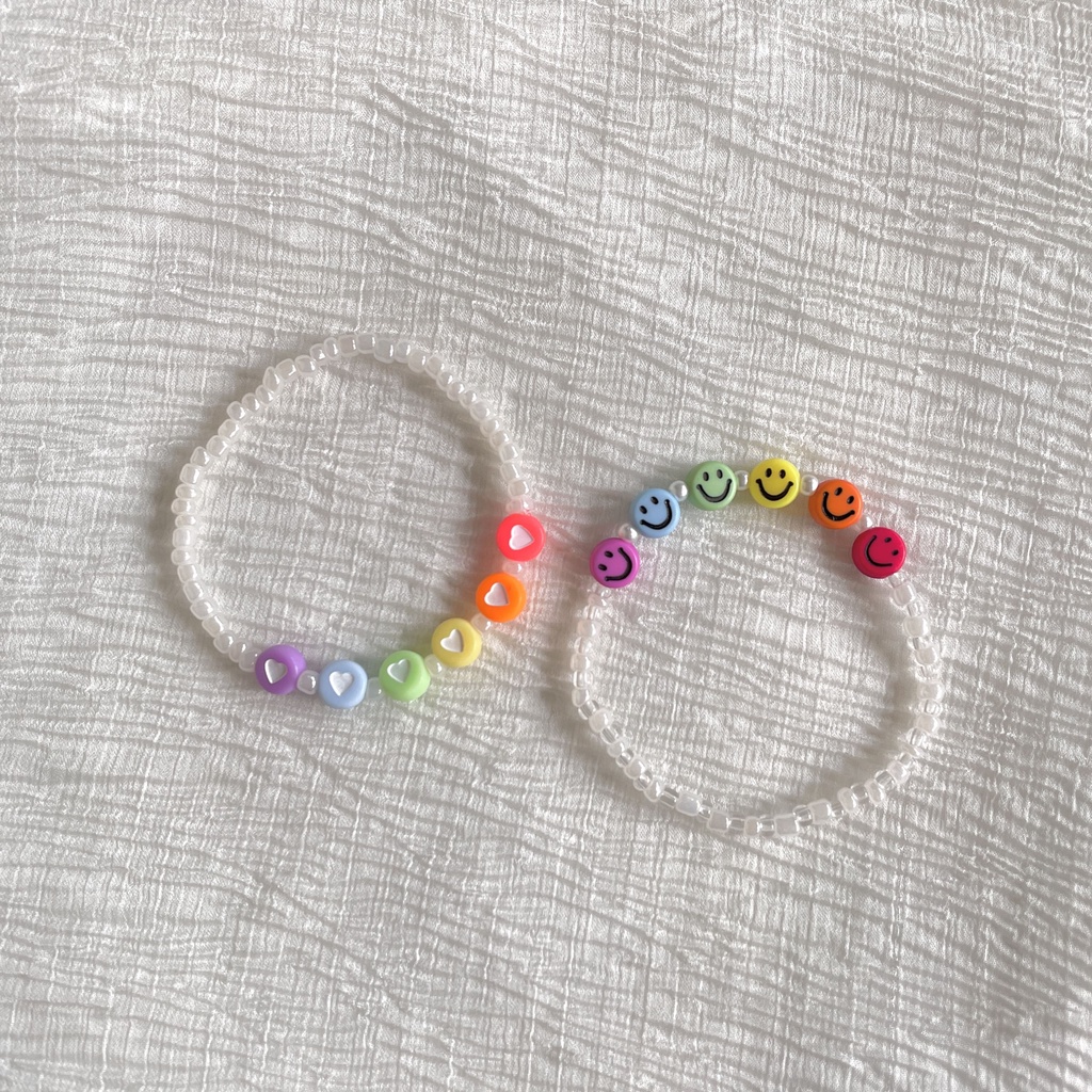 Vòng tay handmade trắng pastel mix hạt charm