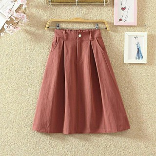 #910 Chân váy xoè thô kaki hè cúc bấm dài qua gối Quảng Châu.