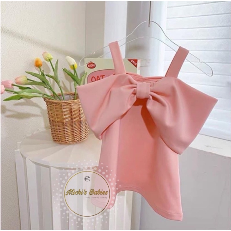 Váy 2 dây nơ ngực bé gái xịn sò 10-22kg
