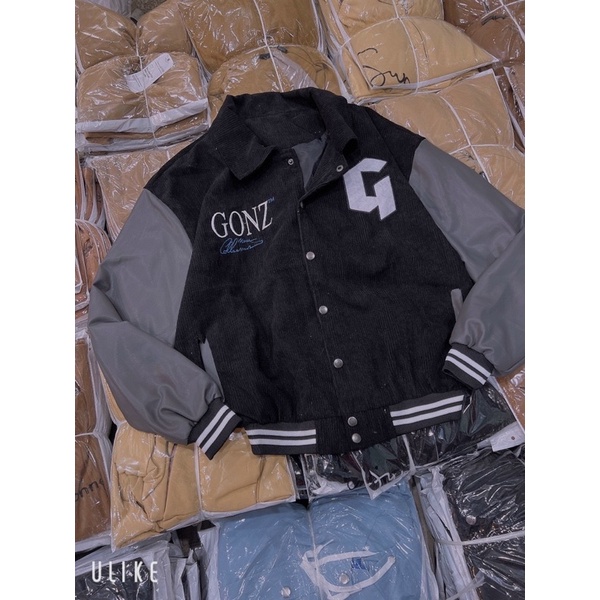 Áo khoác nhung tăm phối tay da lạ mắt in lưng