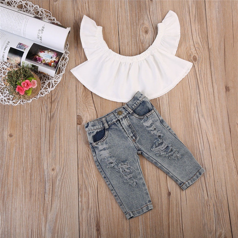 Set áo hở vai + quần jean phối rách dễ thương cho bé