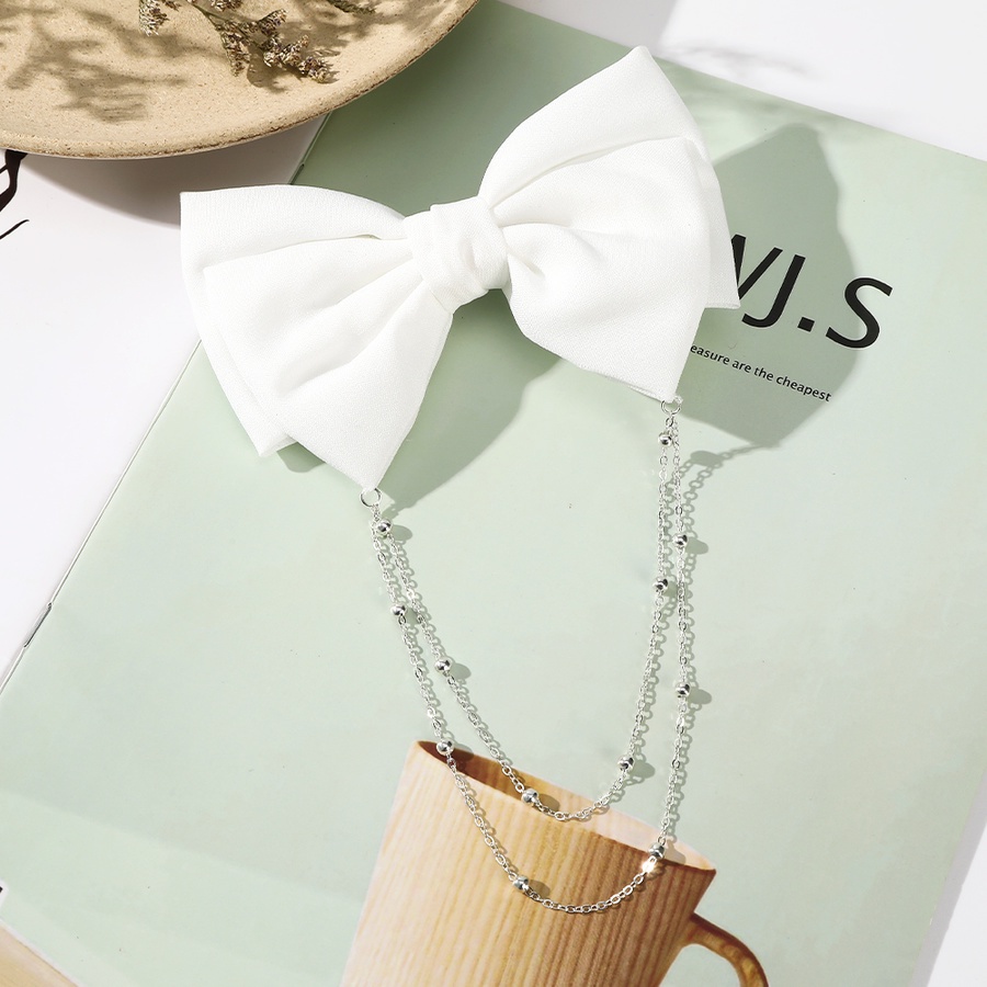 Kẹp tóc hình nơ phối chuỗi ngọc trai phong cách thanh lịch cho nữ