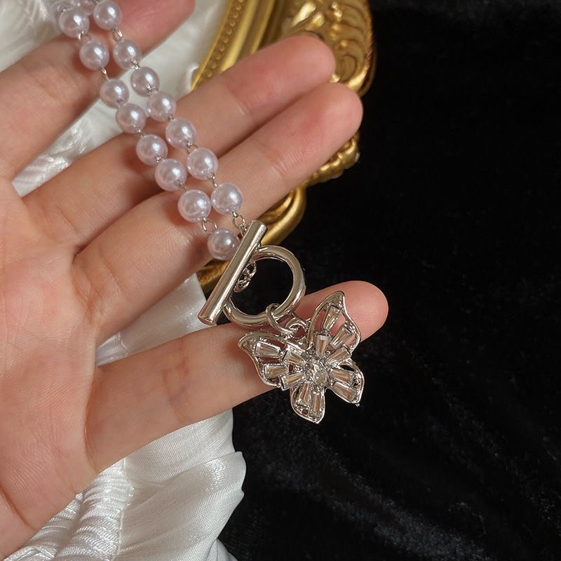 vòng cổ chocker ngọc màu trắng hoạ tiết hình nơ thiết kế xinh xăn cho nữ