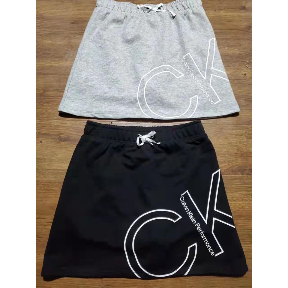 Chân váy Ck hai mầu đen ghi dư xịn size 7-12/14y