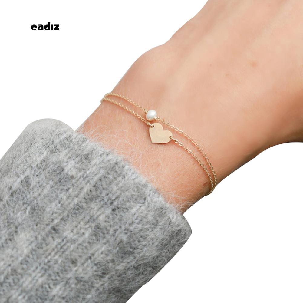 Vòng tay đính hạt giả ngọc trai trái tim