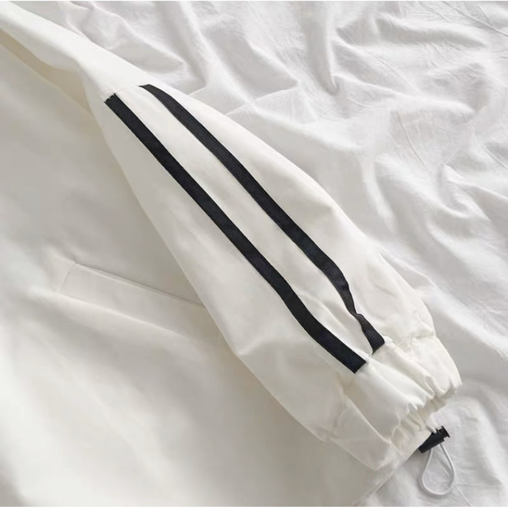 Áo jacket the thao chui dau 2 màu đen, trắng chất kaki