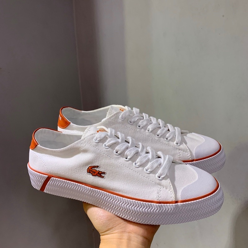 Giày thể thao unisex trắng phối cam thương hiệu Lacoste cao cấp