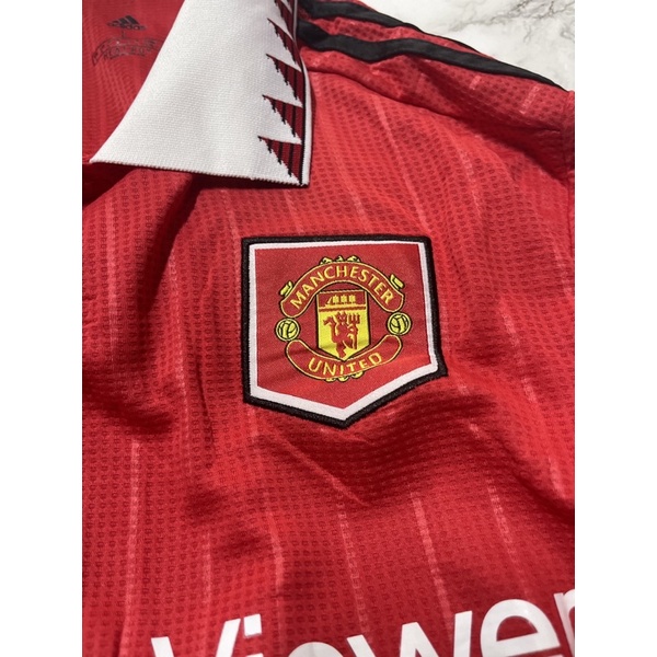 Set bộ quần áo thể thao nam nữ bóng đá clb mu manchester united áo đỏ quần trắng vải gai thái logo thêu đầy đủ