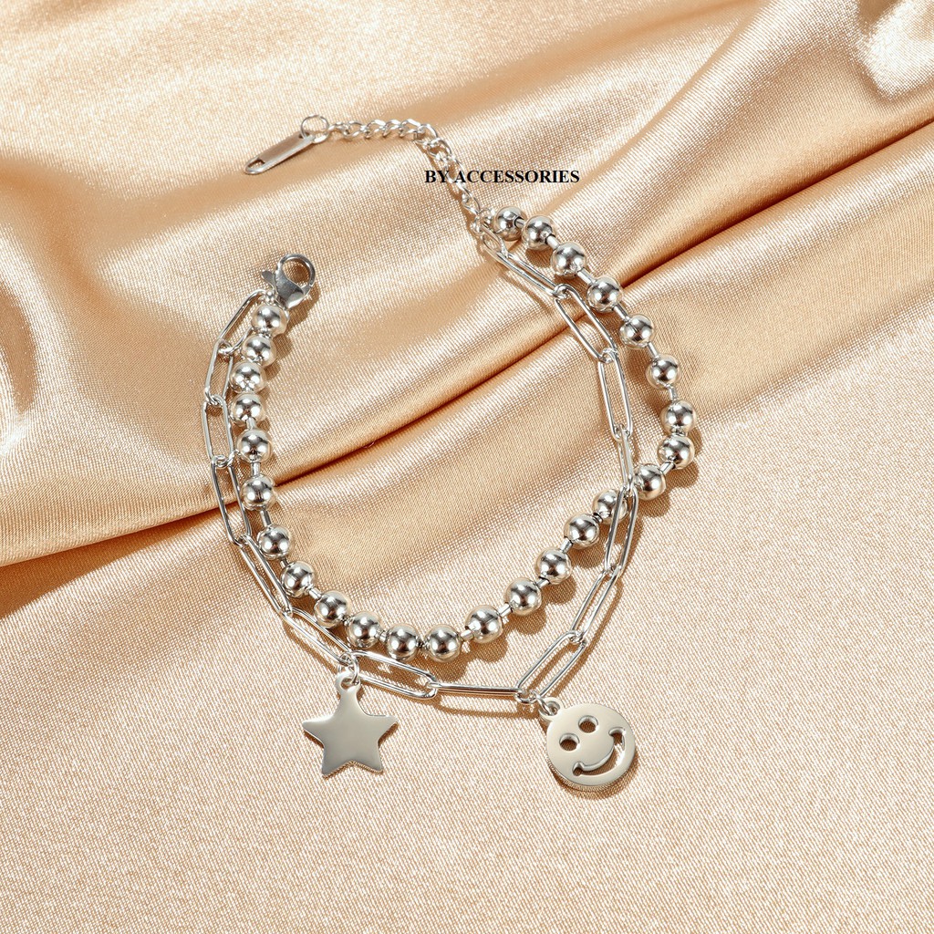 Lắc tay titan xích kép mặt cười ngôi sao không gỉ