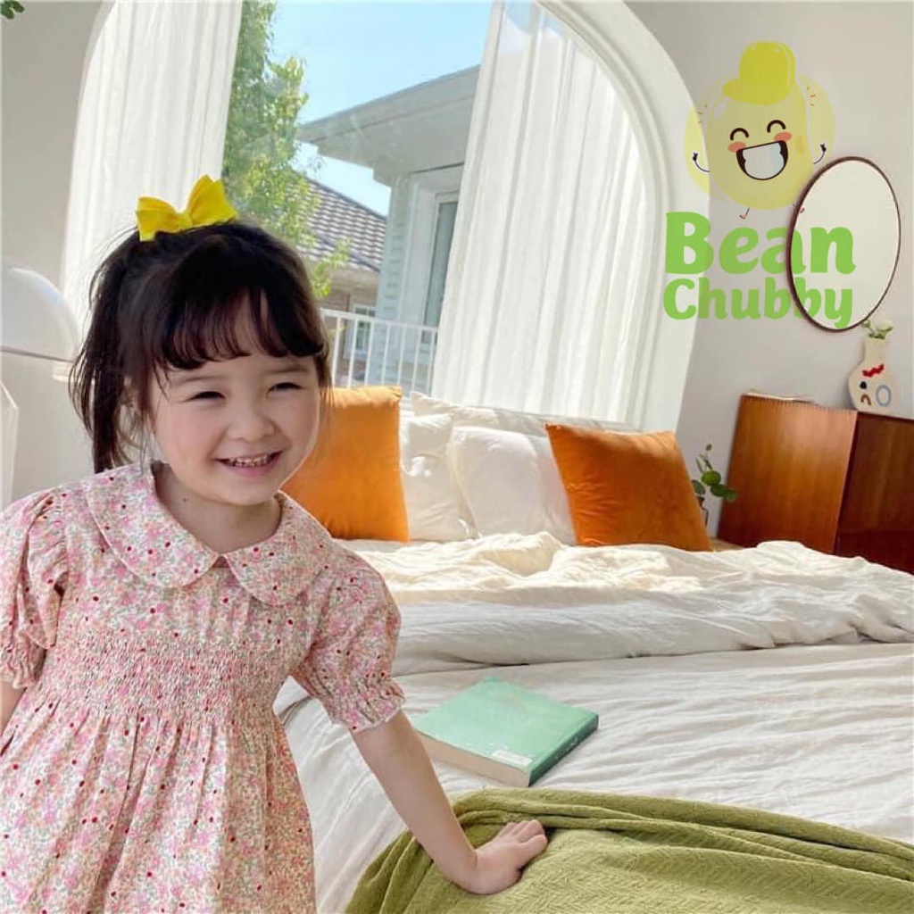 Đầm smock ngực hoa nhí cổ sen bé gái