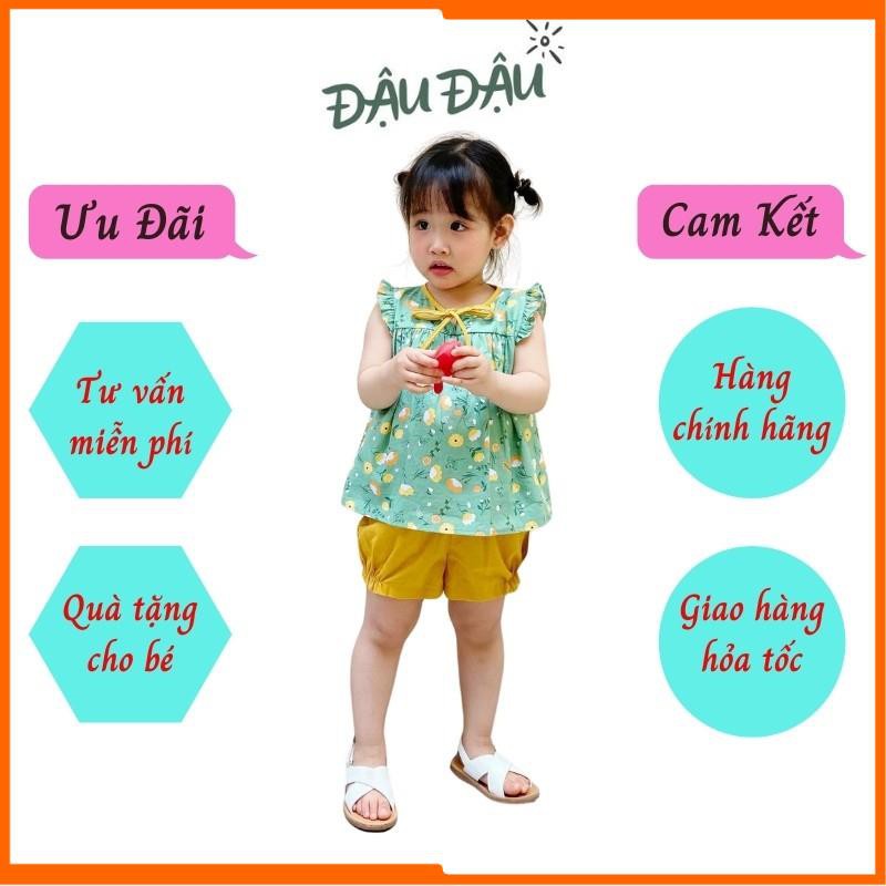 Quần áo trẻ em, quần áo bé gái form áo baby doll, tay viền bèo và cổ thắt nơ điệu đà.