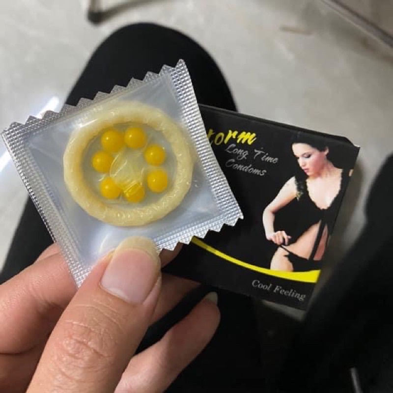 Bao Cao Su TTG 0.01mm Màu Vàng Siêu Mỏng Kéo dài - Nhiều gel gân gai OLO - Hộp 10 bcs tặng 1 storm