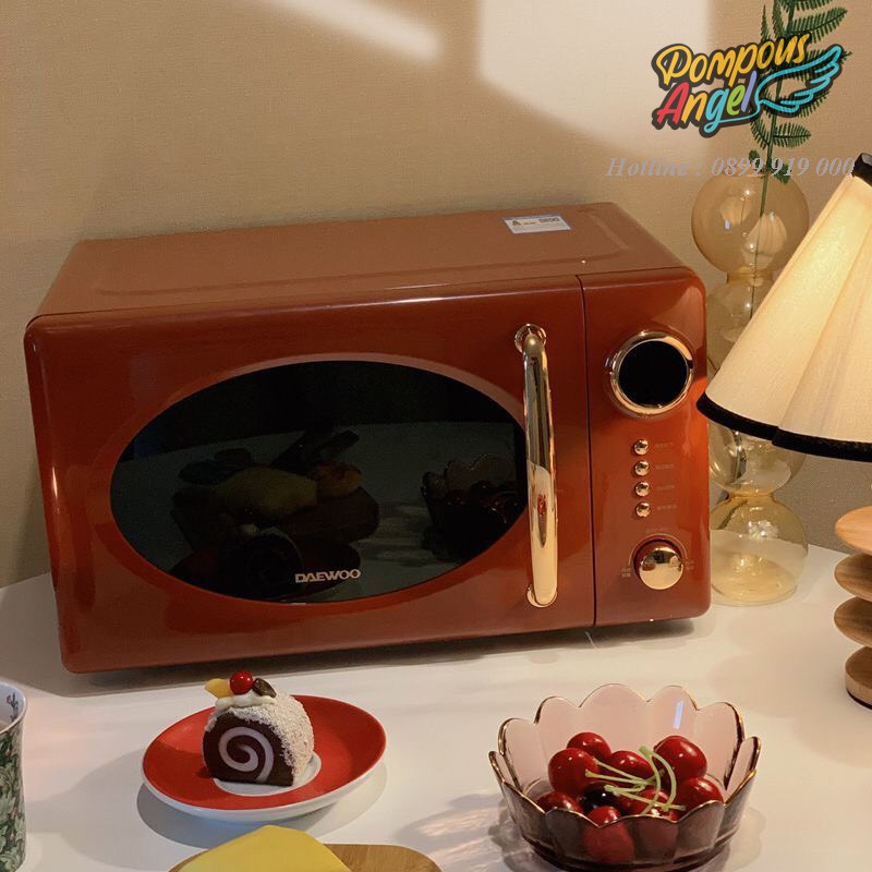 Lò vi sóng điện DAEWOO DY-WB02 màu trắng / đỏ viền vàng ,dung tích 20L bảo hành 12 tháng