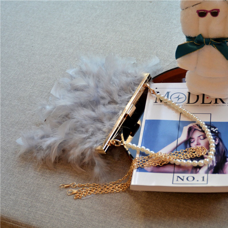 Ví cầm tay đính lông vũ thời trang dự tiệc