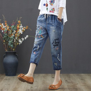Women's jeans are plain, embroidered with personality tear patterns