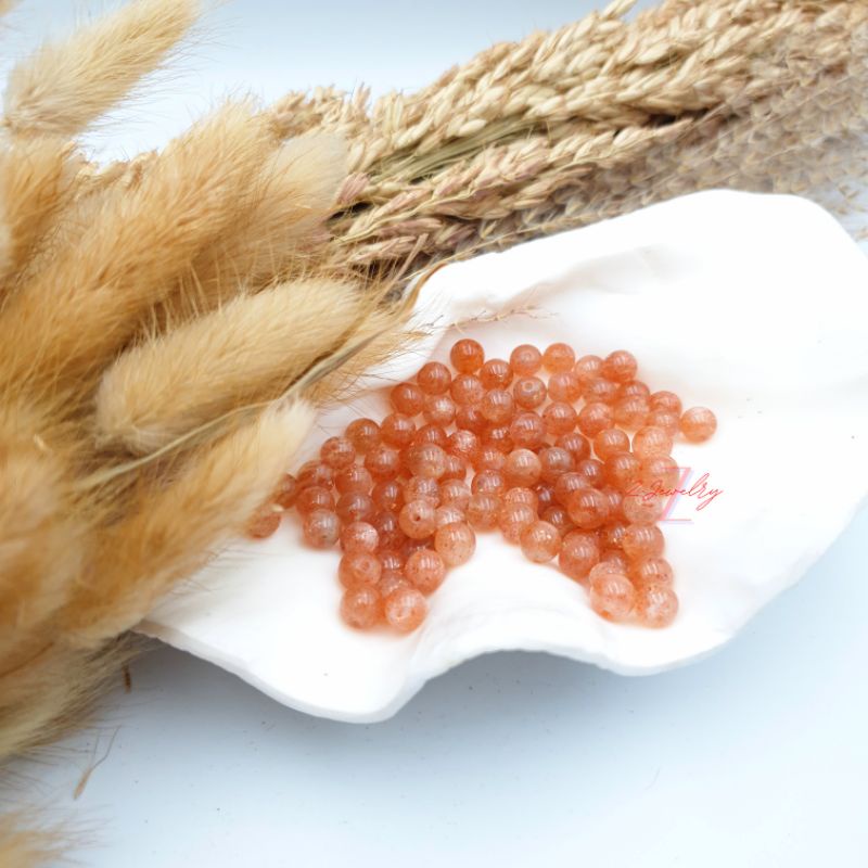 1 hạt đá màu ánh cam Mặt Trời