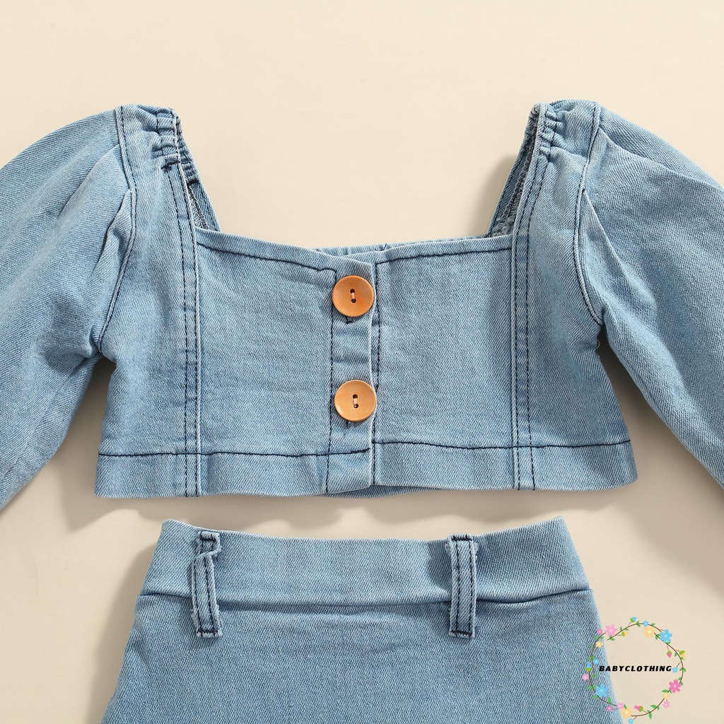 Set trang phục 2 món gồm áo croptop tay phồng cài nút + chân váy jean cho bé gái đi dạo