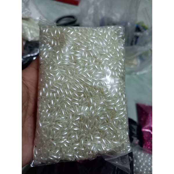 gói 5-10-25gam hạt nhựa hình hạt lúa màu kem 4x8mm