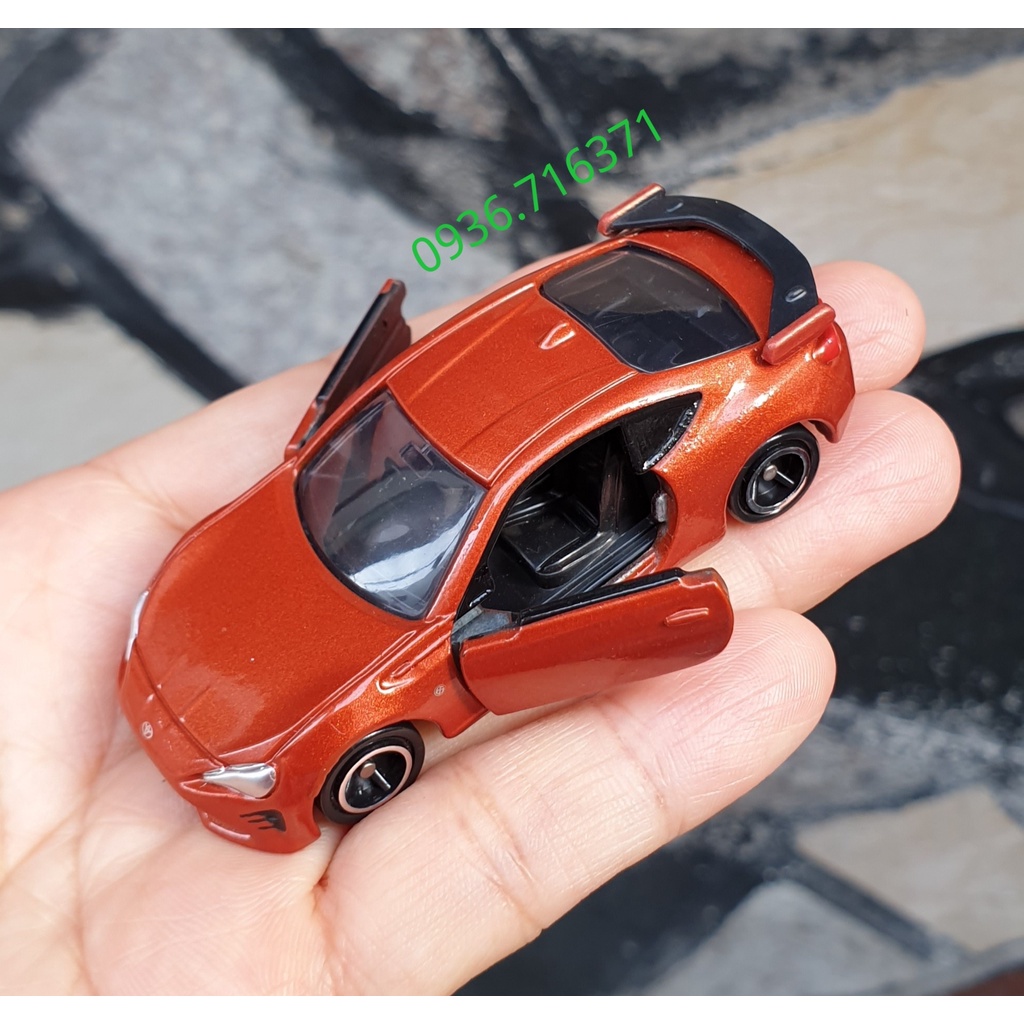 Mô hình siêu xe màu đỏ nâu mở được cửa tomica Nhật Bản