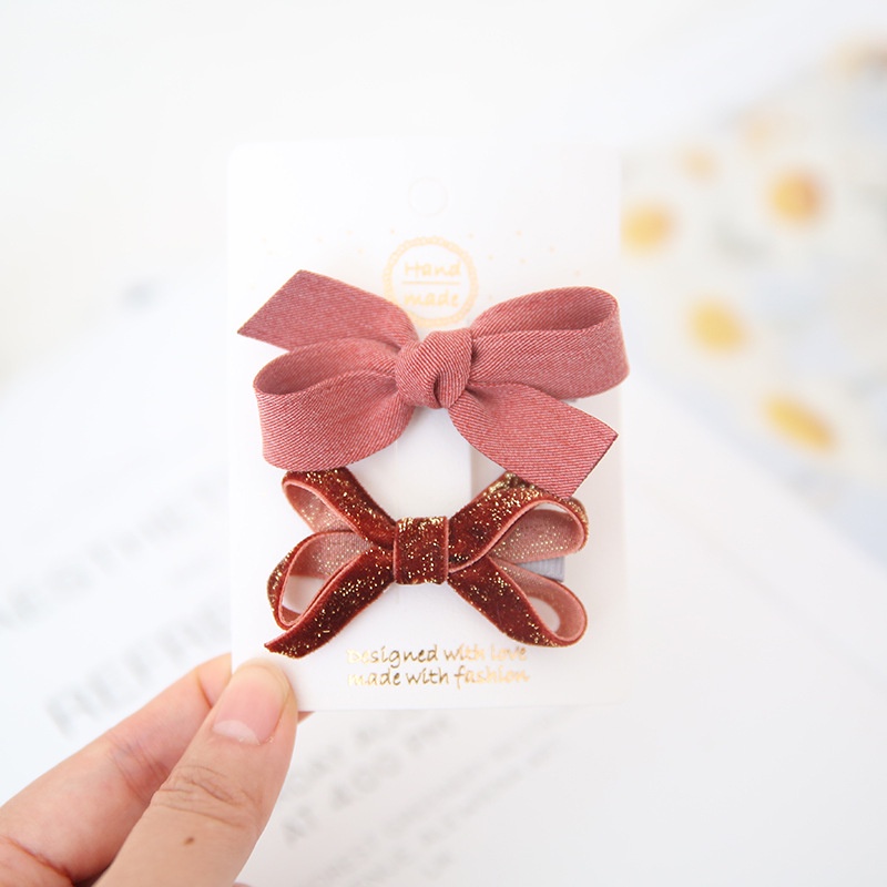 Set 2 kẹp tóc nơ họa tiết chấm bi xinh xắn cho bé gái