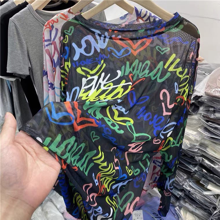 Áo thun lưới mỏng tay dài dáng rộng in họa tiết Graffiti mới cho nữ 2023