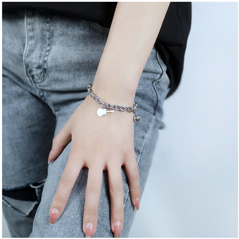 Lắc Tay Nữ Titan Ko Đen Kiểu Dây Xích Cây Đàn Và Trái Châu TT 4067