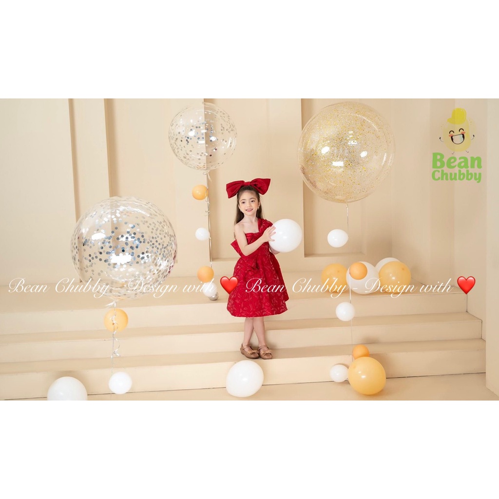 Đầm công chúa lệch vai nơ ngực vải xốp nhăn kèm nơ cặp tóc Shushibaby