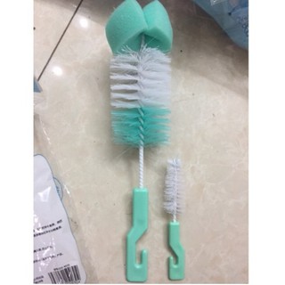 cây cọ rửa bình sữa và núm ti . .