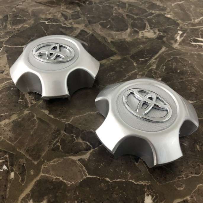 Sản Phẩm Logo chụp mâm, ốp lazang bánh xe ô tô Toyota RAV4 2009-2013 TY-030 .