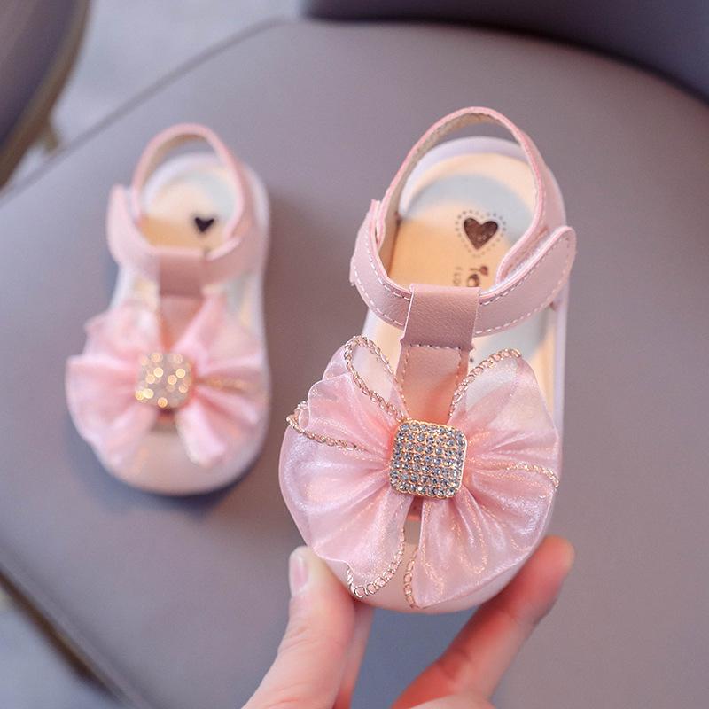 Sandal Nơ Siêu Xinh Mũi Cao Bảo Vệ Chân Bé Cực Mềm Êm Chân