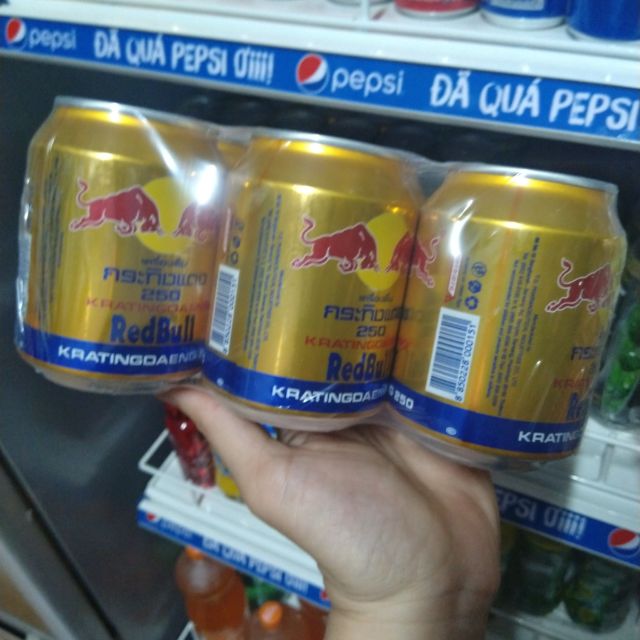 1 lon Nước tăng lực bò húc redbull Thái Lan 330ml