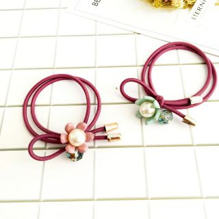 Cột tóc hoa rơi đính châu cute
