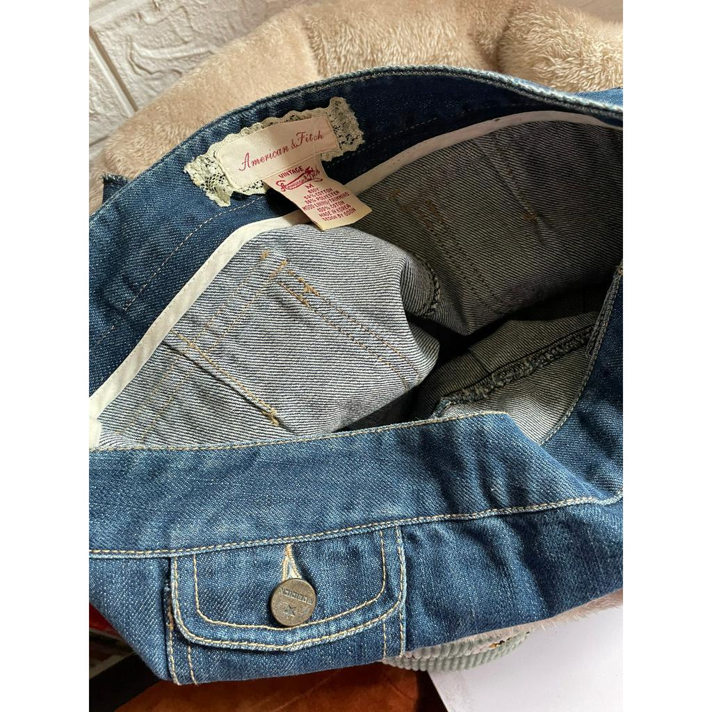 Chân váy jeans xếp ly cạp trễ