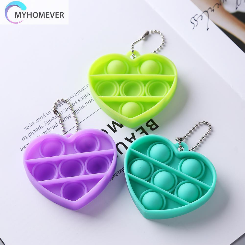 Móc khóa silicon hình trái tim có thể bóp tay đàn hồi bề mặt bật bong bóng
