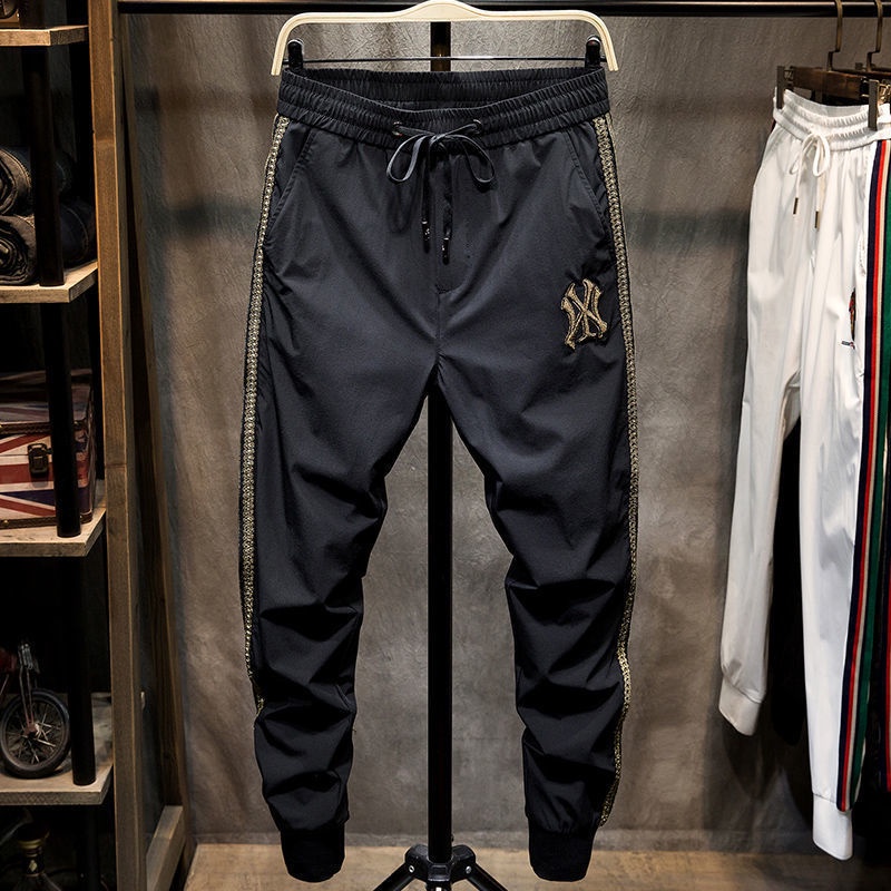 Quần thể thao dài in logo thoải mái thời trang mùa thu mới phổ biến cho nam