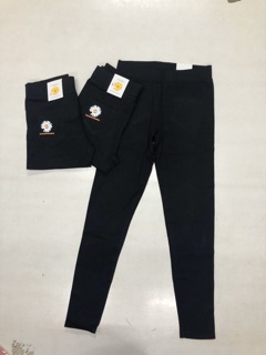 Quần legging in hoa cúc vàng