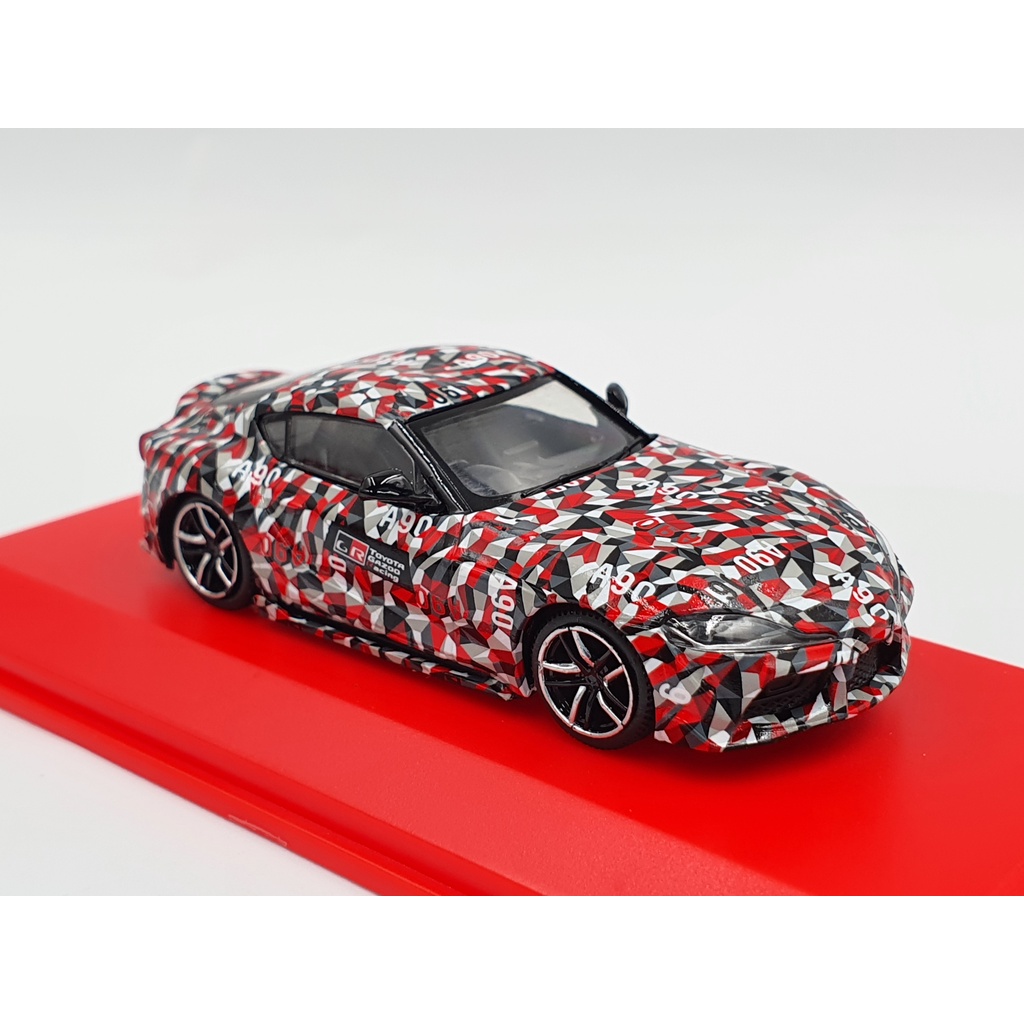 Xe Mô Hình Toyota GR Supra TEST CAR 1:64 Tarmac Works/Kyosho(CARO ĐỎ XÁM)