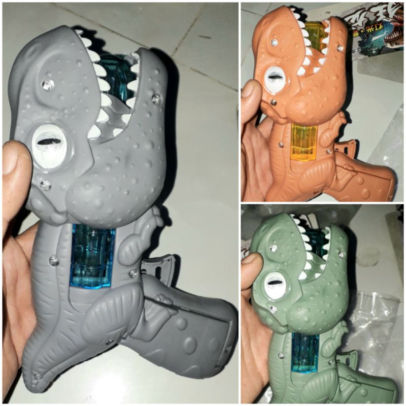 Một cái mô hình khủng long dài 18cm bằng nhựa có nhạc và đèn led rất đẹp tặng kèm pin