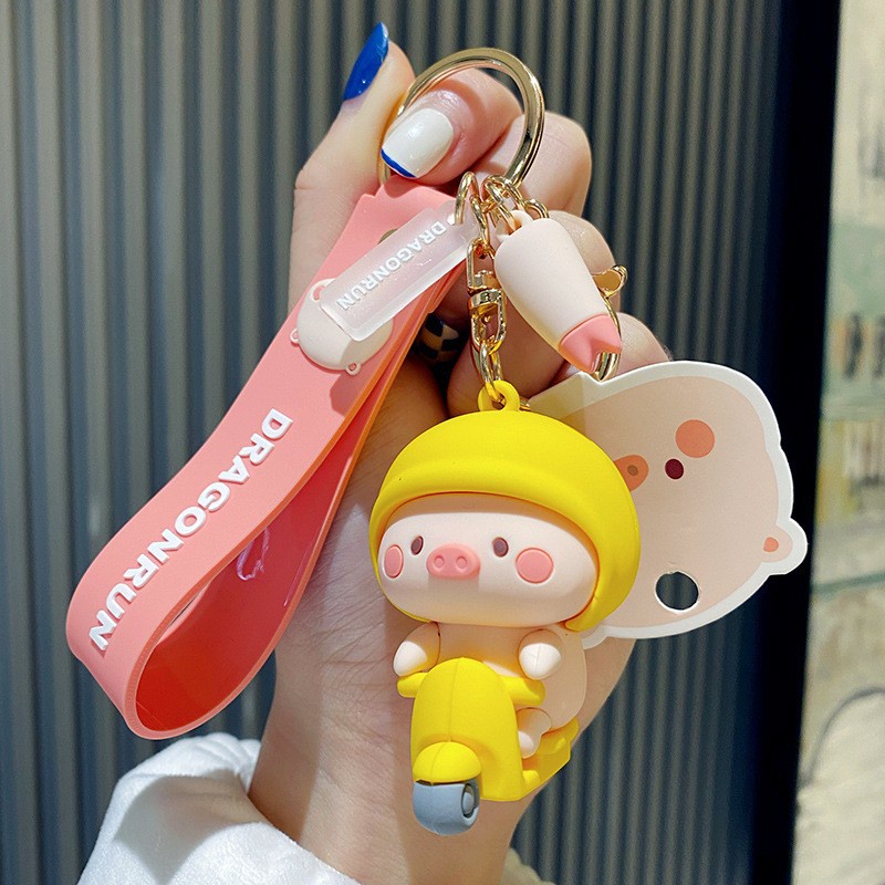 Móc khóa bé Heo đi xe máy