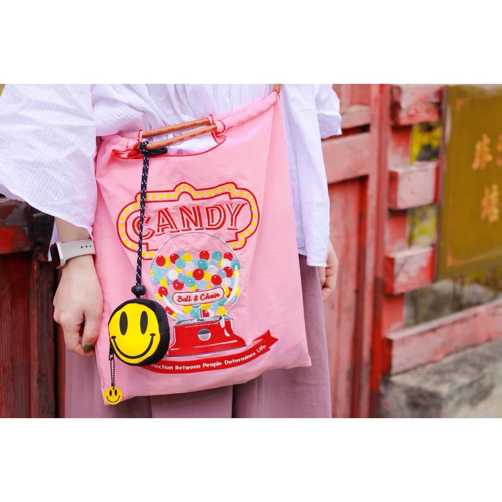 Niche design ins coin purse small mini headphone bag hanging neck tide brand smiley key storage bag pendant