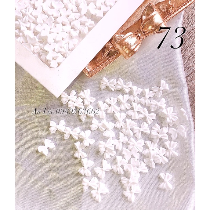 Charm nơ đính móng