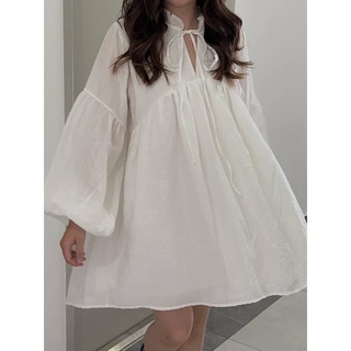 Đầm babydoll dài tay cột nơ đũi xước